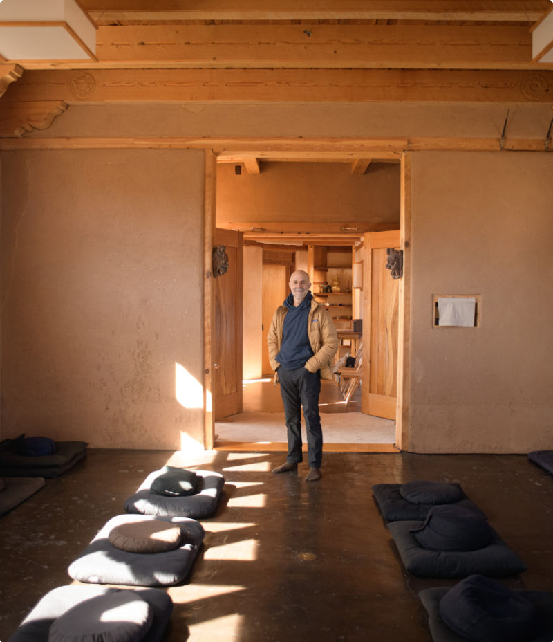 Henry Shukman standing in meditation room at Mountain Cloud Zen Center