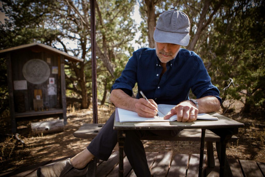 Henry Shukman writing his notes at Mountain Cloud Zen Center
